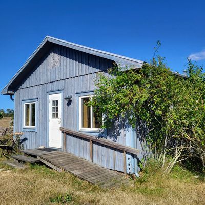 Stuga på ekologisk bondgård med djur