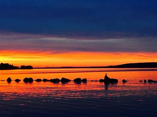 Solnedgång vid Siljans strand.